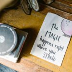 Inspirational quote with crystals and books, capturing a mystical vibe.